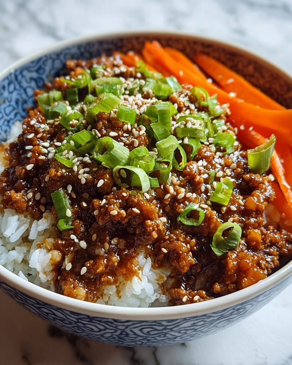 A bowl with three main layers: at the bottom, white sticky rice forms a soft base visible at the edges; on one side, thin orange carrot strips add a crunchy texture; the top layer is cooked ground meat covered in a glossy brown sauce, sprinkled all over with small white sesame seeds and bright green chopped scallions. The bowl is white with a blue pattern inside, and the scene is set on a white marbled surface. photo taken with an iphone --ar 4:5 --v 7
