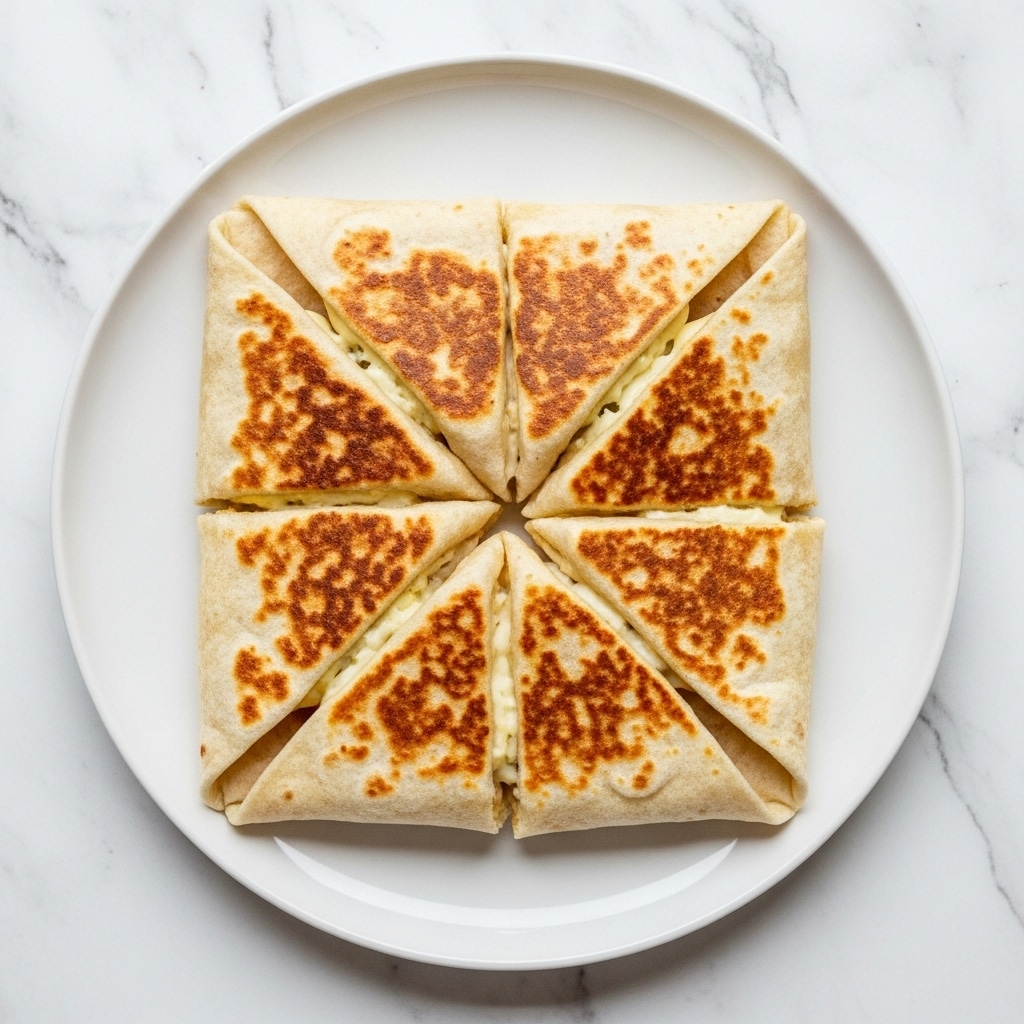 The image shows three pieces of a quesadilla on a shiny black plate, set against a white marbled surface. Each quesadilla slice has a toasted, slightly browned flour tortilla with three visible layers inside. The bottom layer is browned cooked ground beef with a crumbly texture, above it is melted yellow cheese that looks smooth and creamy, and the top layer contains fresh diced red tomatoes mixed with shredded pale green lettuce and a dollop of white sour cream. The quesadilla slices are stacked and slightly overlapping, showing the gooey inside clearly. Photo taken with an iphone --ar 4:5 --v 7