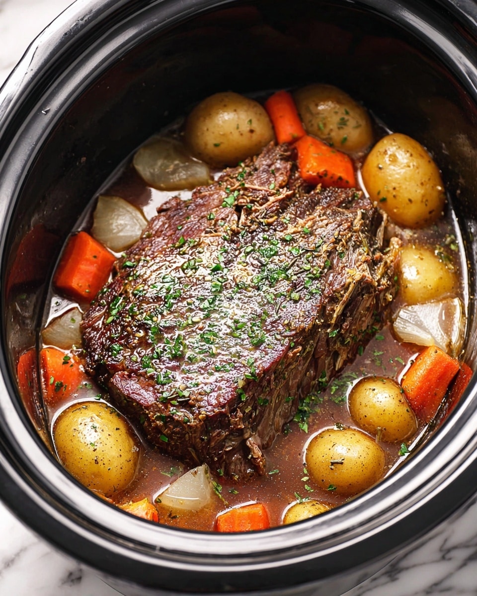 A large piece of brown, well-seasoned meat sits in the center of a black slow cooker, with a shiny, slightly oily surface and green herb sprinkles on top. Surrounding the meat are several whole light brown potatoes with bits of green herbs, bright orange cut carrots, and translucent cooked onion pieces. The dish is in a brownish broth filling the bottom of the slow cooker, all on a white marbled surface. photo taken with an iphone --ar 4:5 --v 7